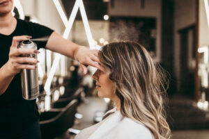 Woman at Hair Salon getting hair done by stylist