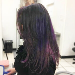 Woman's medium length haircut and style with purple color