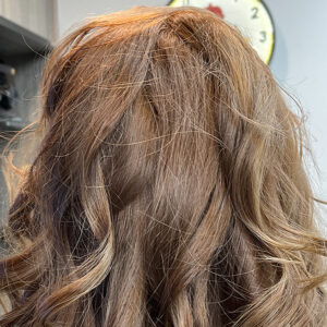 Chestnut color with cut and beach wave styling